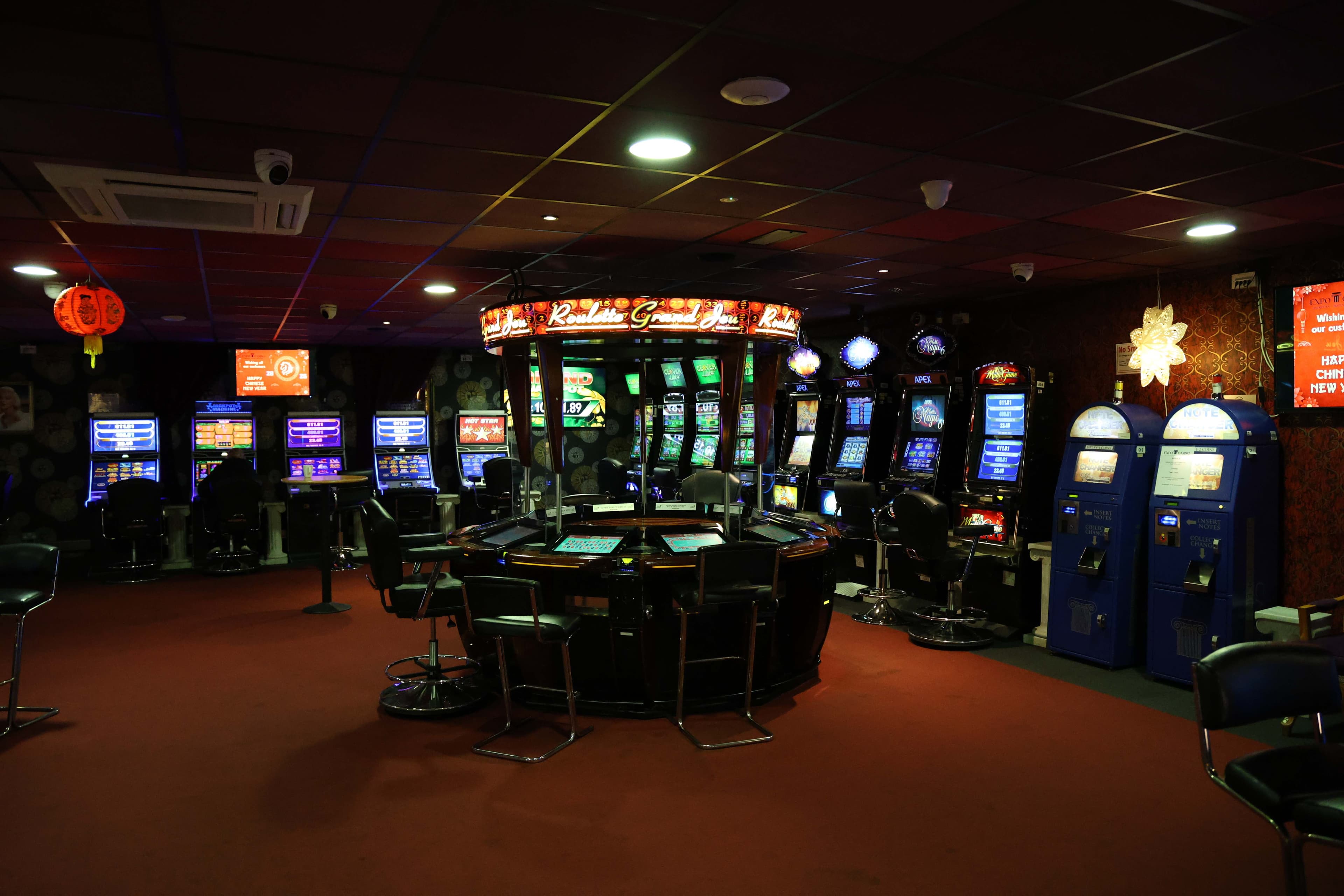 Grand Roulette table with surrounding gaming machines